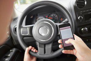 Chicago auto accident lawyer, distracted driving, handheld cell phones, hands-free device law, texting while driving, distracted driving cases, distracted driving laws, Illinois distracted driving, hands-free device